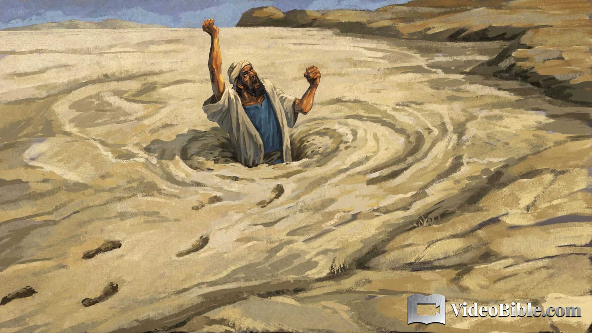 man sinking in quick sand and cursing God
